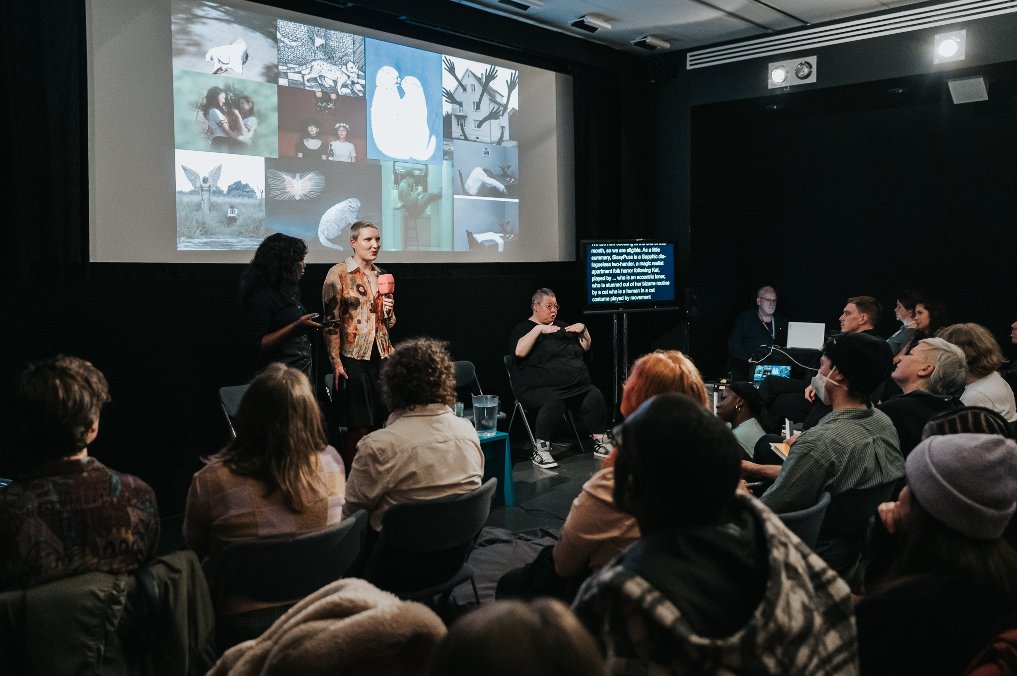 Two people pitching a film to an audience.