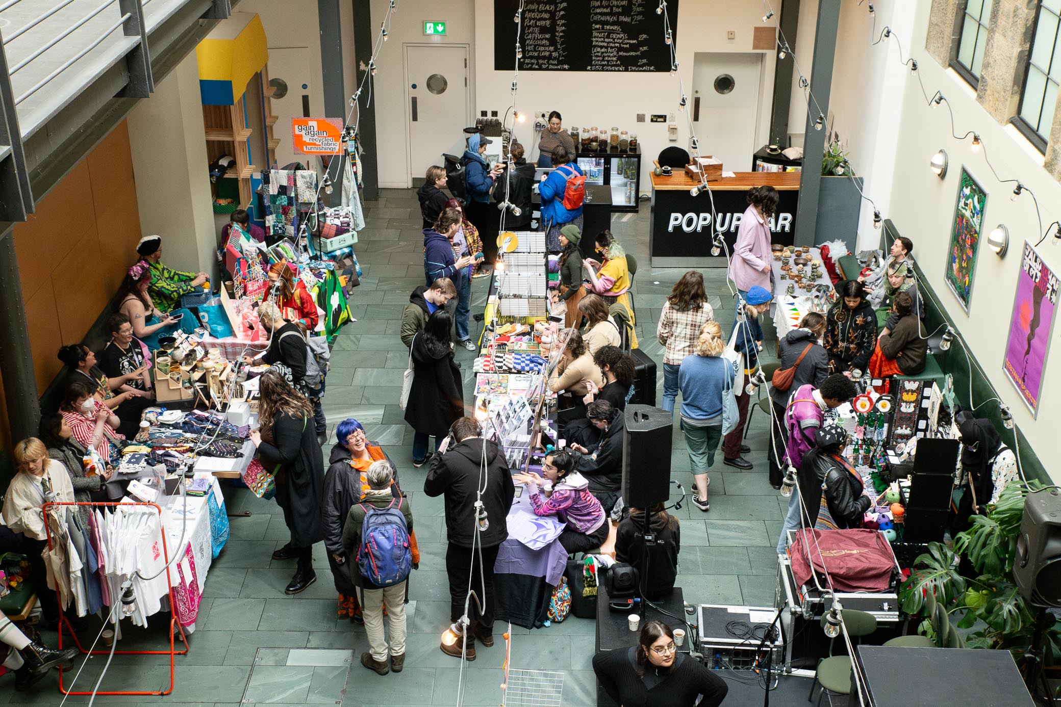 Birds eye view of SQIFF 2024 craft fair with many sellers showcasing their work.
